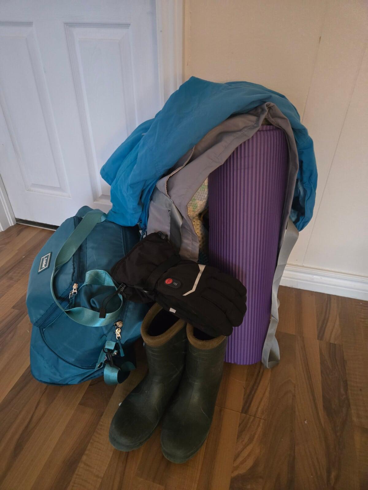 yoga mat, gloves, boots and overnight bag ready to go